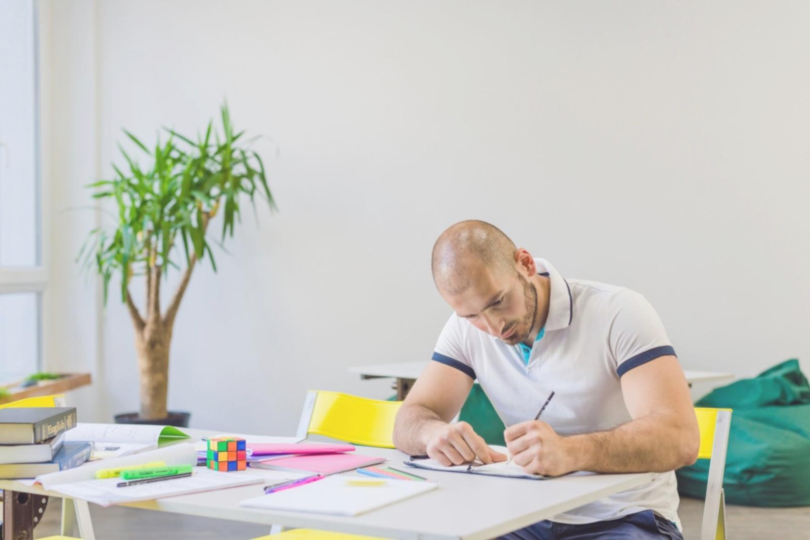 Students analyzing market data on multiple screens in modern learning environment
